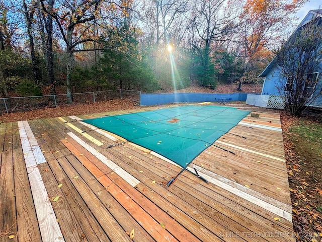 view of pool with a wooden deck