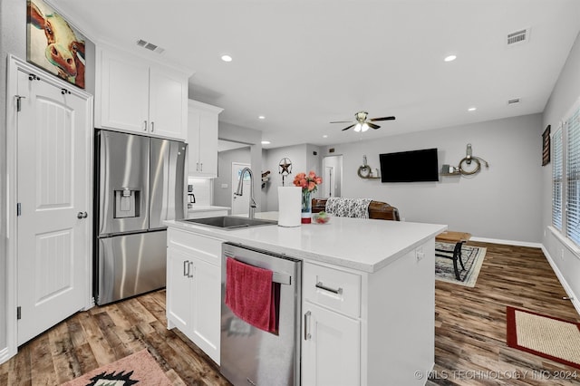 kitchen with sink, white cabinetry, an island with sink, and appliances with stainless steel finishes