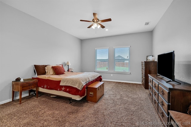 bedroom featuring dark colored carpet and ceiling fan