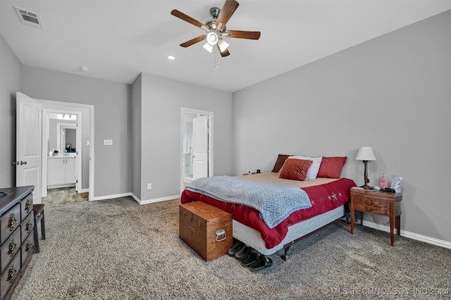 carpeted bedroom with ceiling fan and ensuite bathroom