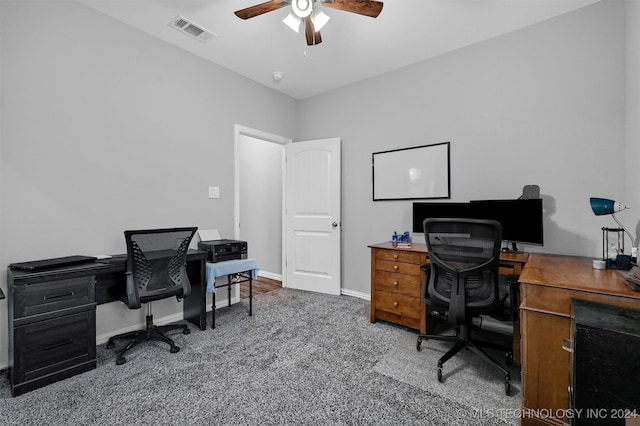 carpeted office featuring ceiling fan