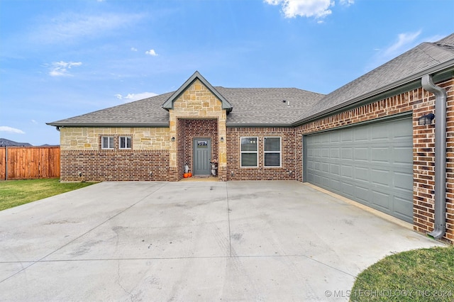 view of front of property with a garage