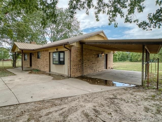 exterior space with a carport