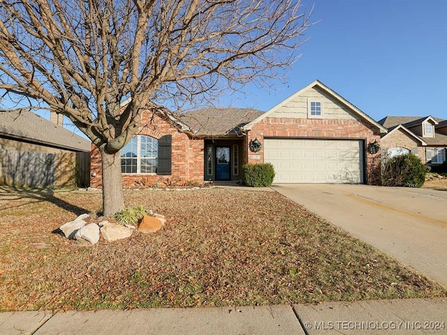 single story home featuring a garage