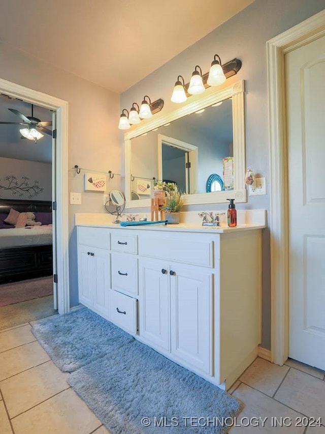 bathroom featuring tile patterned floors, ceiling fan, and vanity