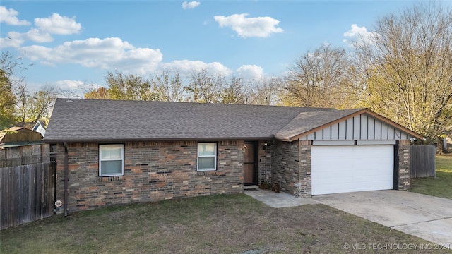 ranch-style house featuring a garage