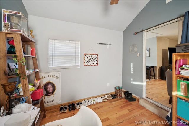 playroom with hardwood / wood-style flooring and lofted ceiling