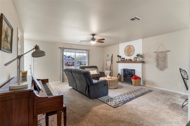 carpeted living room featuring ceiling fan