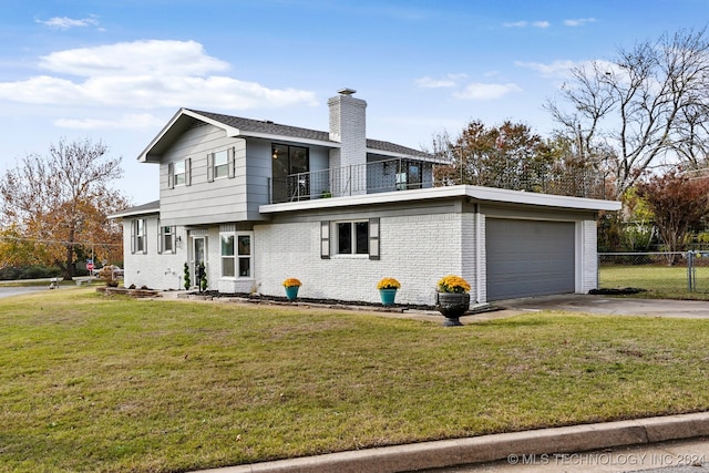 view of front facade with a balcony, a front yard, and a garage