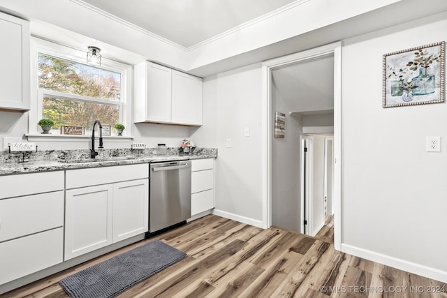 kitchen featuring light stone countertops, light wood-type flooring, sink, dishwasher, and white cabinetry