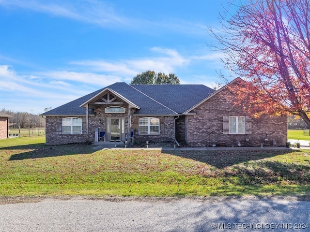 ranch-style house with a front lawn