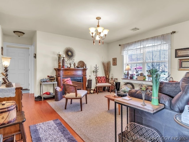 living room featuring a chandelier and hardwood / wood-style flooring