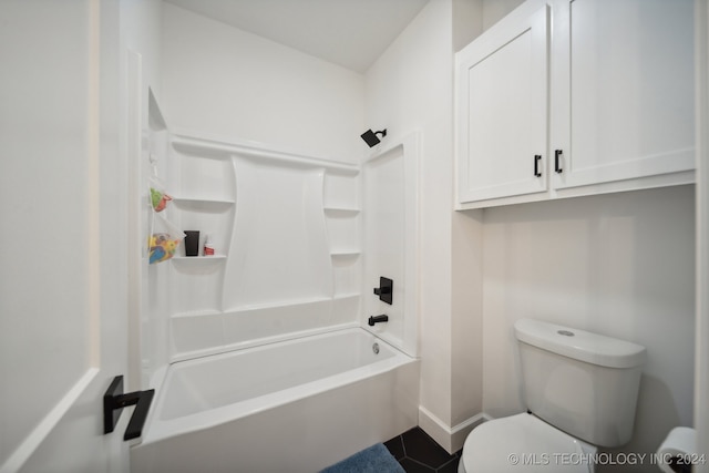 bathroom with shower / washtub combination and toilet