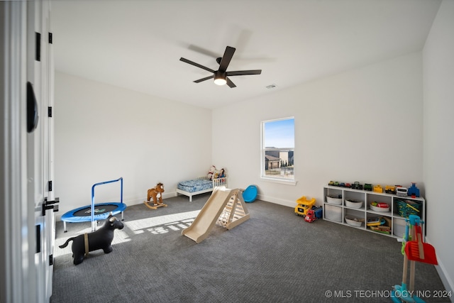 recreation room featuring carpet and ceiling fan