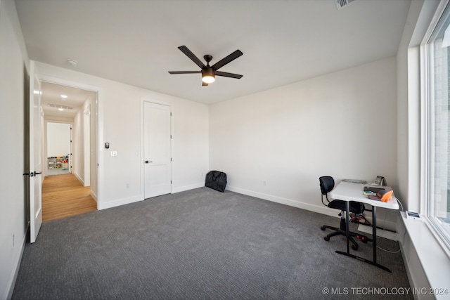 office featuring ceiling fan and dark colored carpet