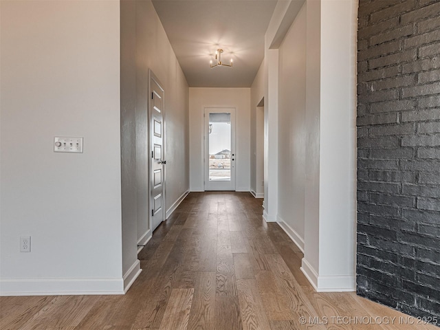 doorway featuring wood-type flooring