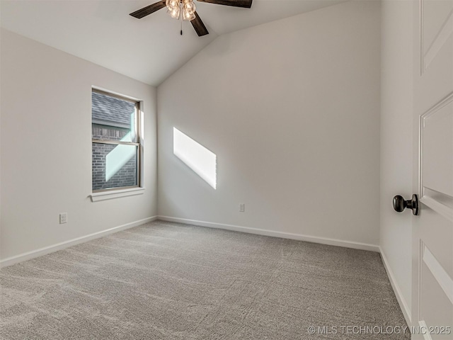 unfurnished room featuring lofted ceiling, carpet, and ceiling fan