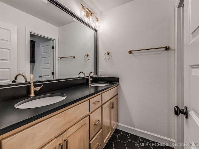 bathroom featuring tile patterned flooring and vanity