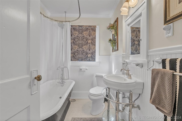 bathroom with crown molding, tile patterned flooring, sink, and toilet