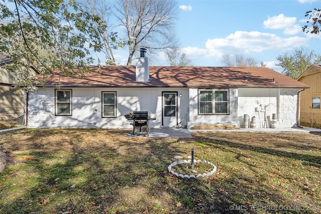 back of house with a yard