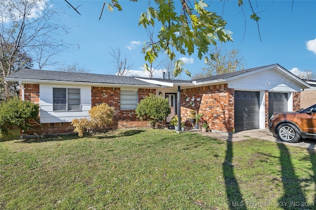 ranch-style home with a front yard and a garage