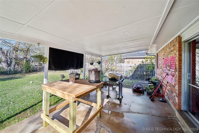 view of patio featuring a grill