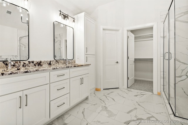 bathroom with vanity and walk in shower