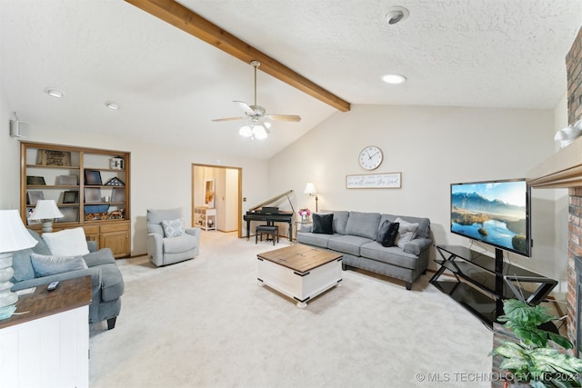 carpeted living room featuring lofted ceiling with beams, ceiling fan, and a textured ceiling