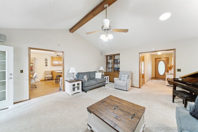 carpeted living room with ceiling fan and lofted ceiling with beams