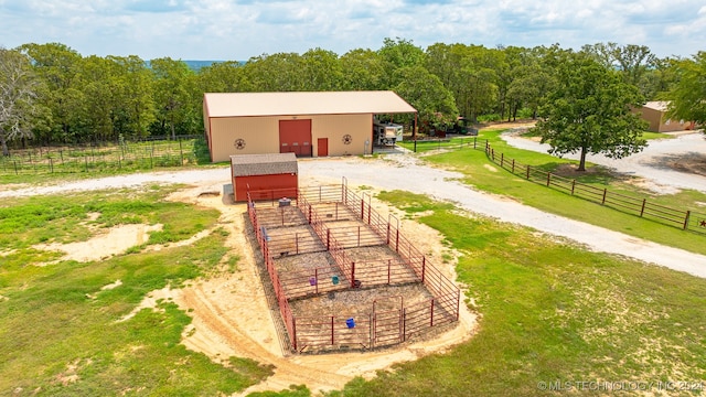 surrounding community featuring a rural view and an outbuilding