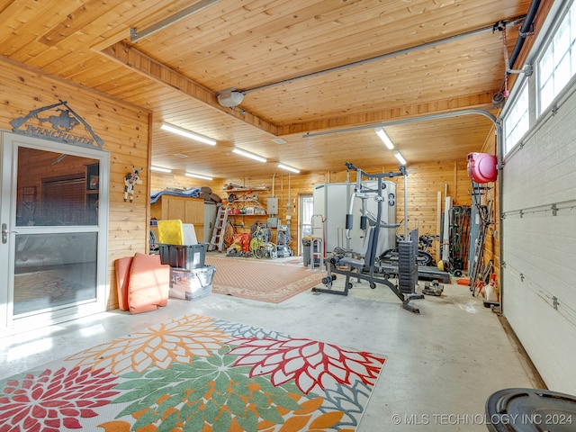 workout room featuring wooden walls