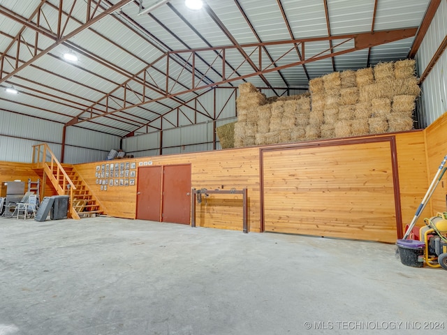 garage featuring wooden walls