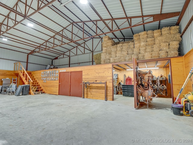 garage featuring wooden walls