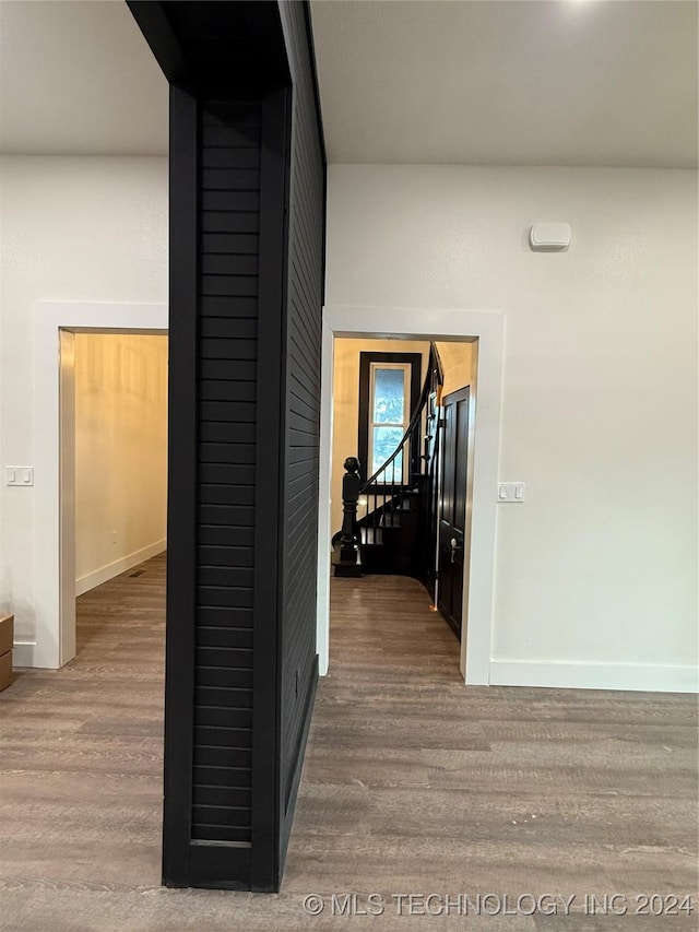 hallway featuring hardwood / wood-style flooring