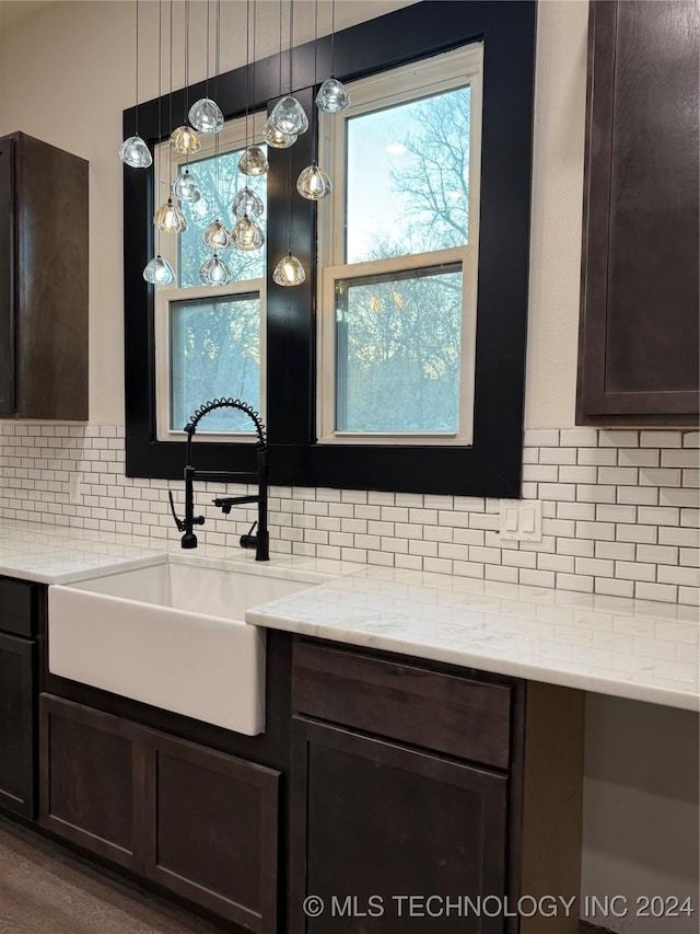 bathroom featuring decorative backsplash, hardwood / wood-style floors, and vanity