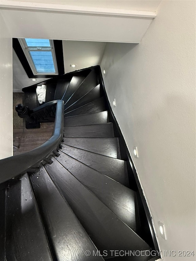 stairway with a skylight