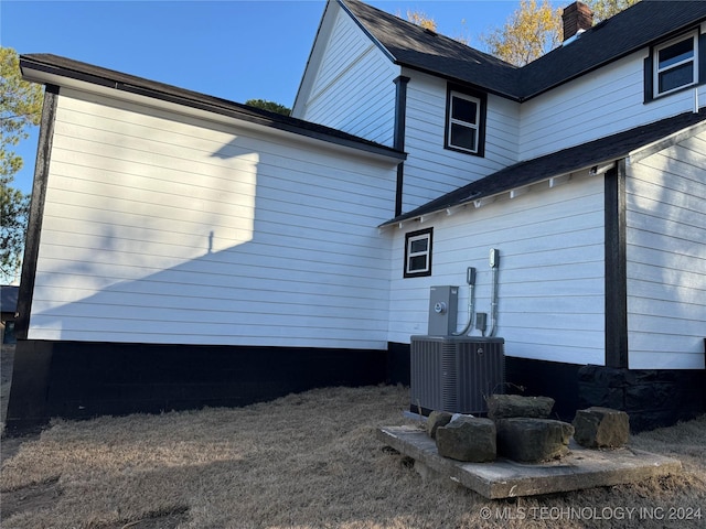 view of home's exterior featuring central AC unit