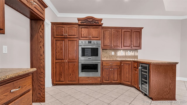 kitchen featuring beverage cooler, stainless steel double oven, tasteful backsplash, light tile patterned floors, and ornamental molding