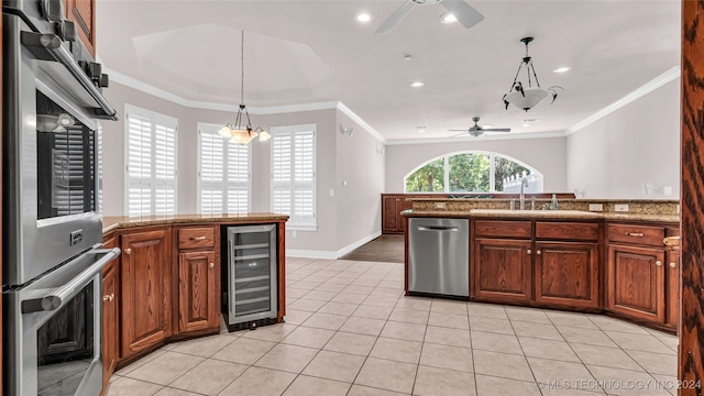 kitchen featuring ornamental molding, sink, beverage cooler, and appliances with stainless steel finishes