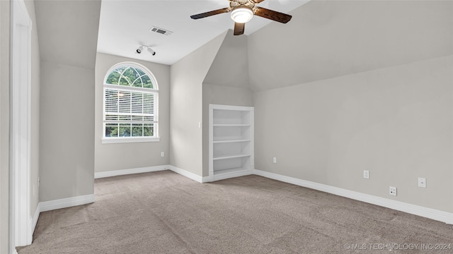 bonus room with light carpet, vaulted ceiling, and ceiling fan