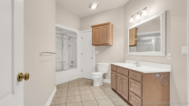 full bathroom with tile patterned flooring, toilet, combined bath / shower with glass door, and vanity