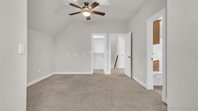 unfurnished room with ceiling fan, light colored carpet, and lofted ceiling