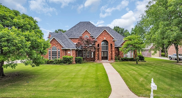 view of front of property with a front lawn