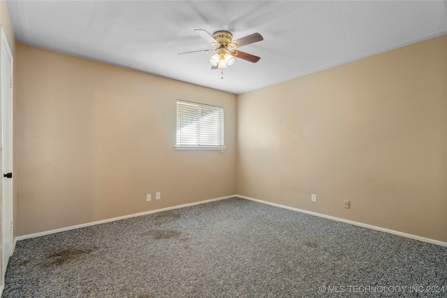 unfurnished room with carpet flooring and ceiling fan