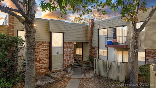 view of front of property with a balcony