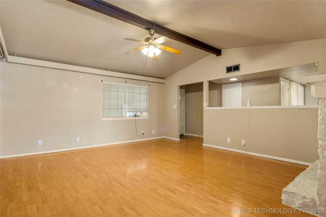 spare room featuring ceiling fan, light hardwood / wood-style flooring, and lofted ceiling with beams