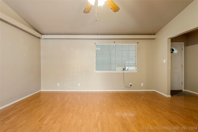 unfurnished room featuring wood-type flooring, ceiling fan, and lofted ceiling