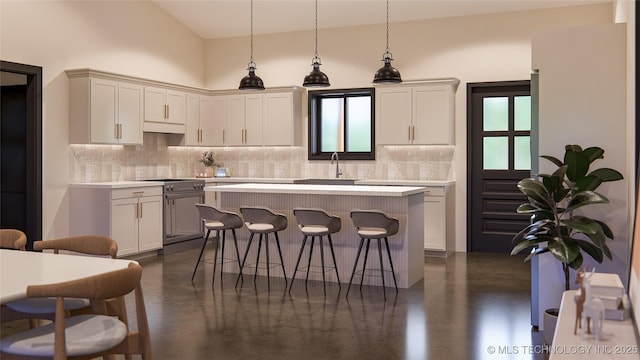 kitchen featuring sink, a breakfast bar area, high end stainless steel range oven, a center island, and decorative light fixtures