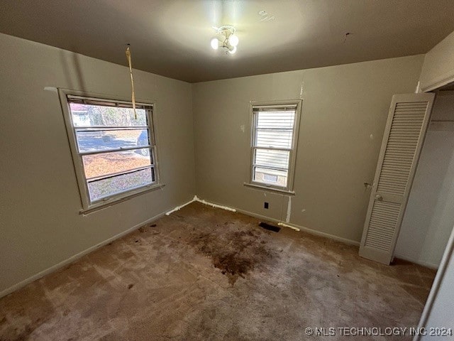 unfurnished dining area with carpet flooring