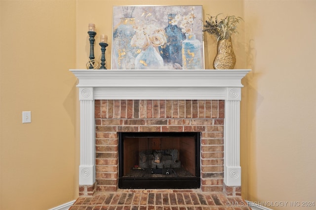 interior details with a brick fireplace